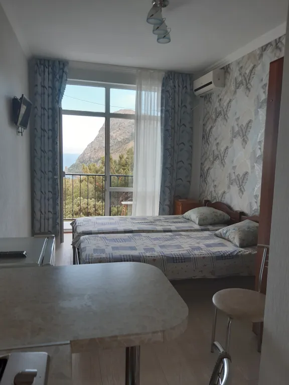 Номер с видом на море и горы