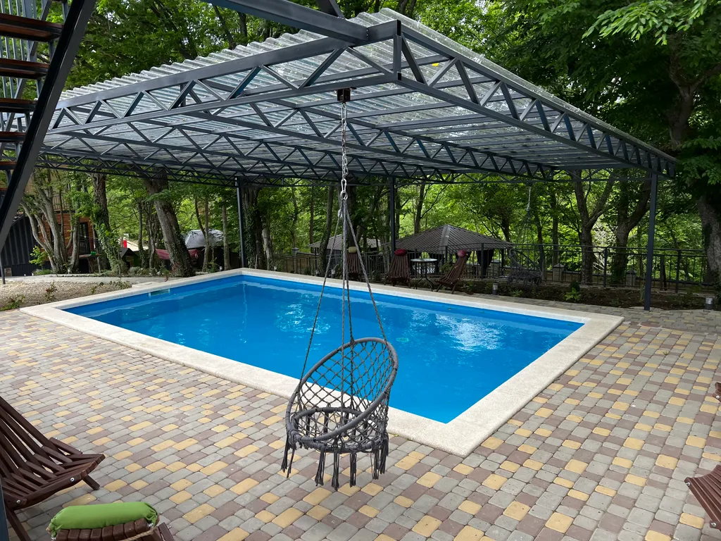 Домик в лесу у моря с верандой