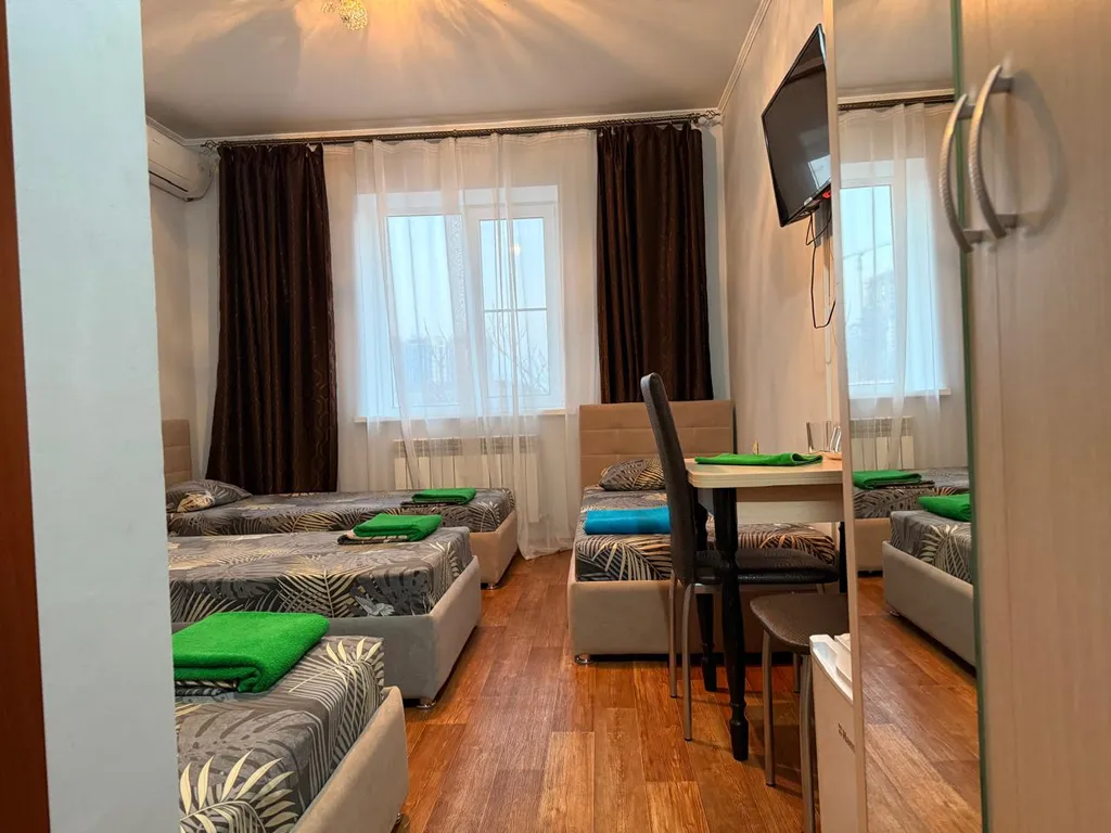 Четырехместный номер с 4-мя односпальными кроватями