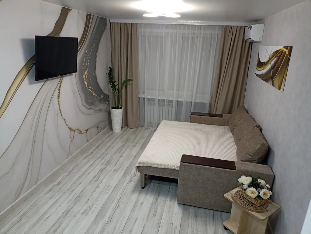 Квартира в центре на первом этаже с асфальтированной парковкой