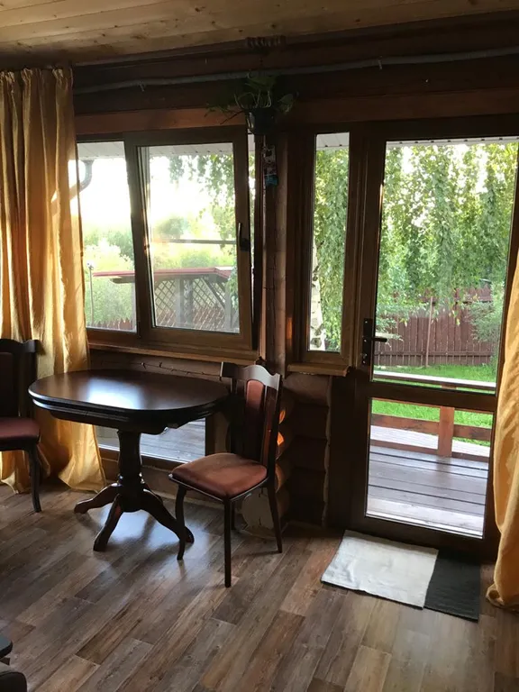 Дом из бревна Терем с сауной в черте города