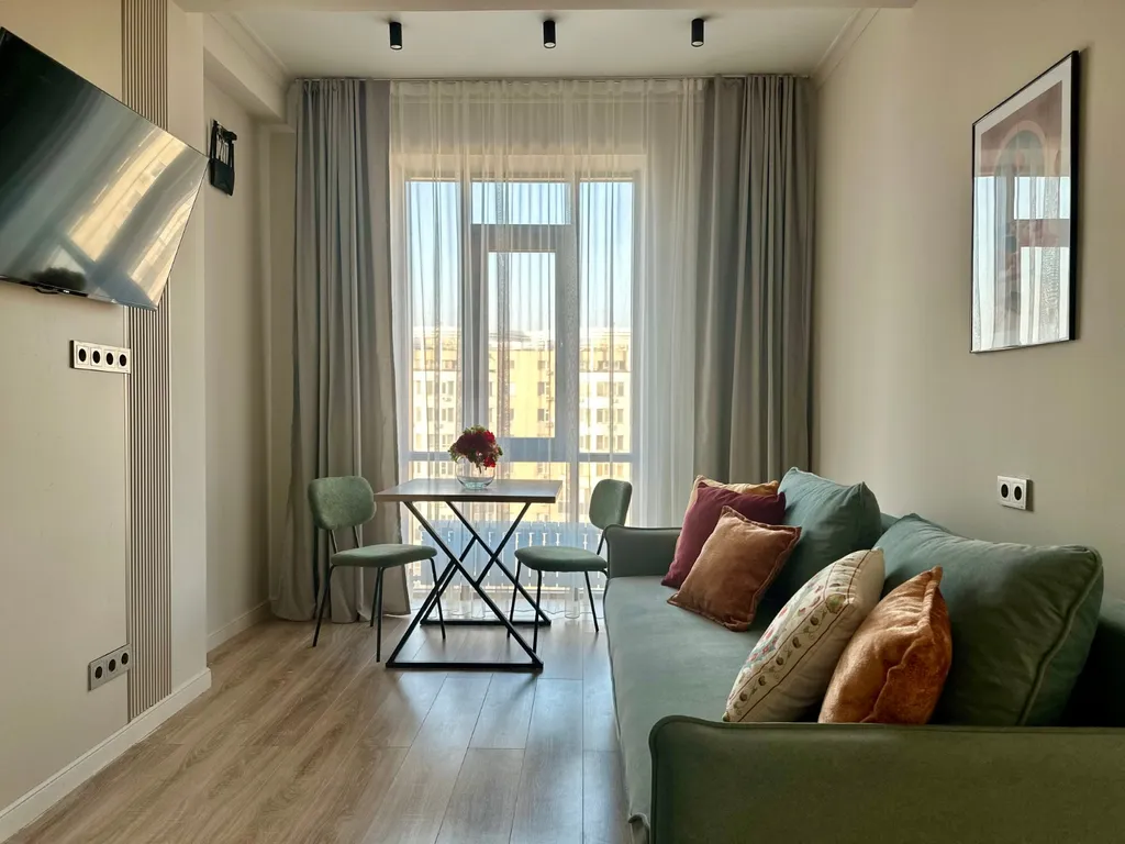 Квартира Уютная студия Нурай в центре Алматы — Алматы