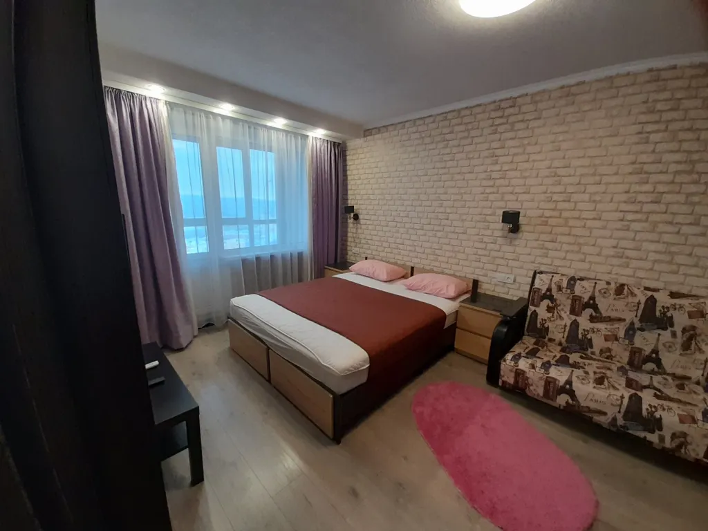 Квартира с балконом и видом на город и залив