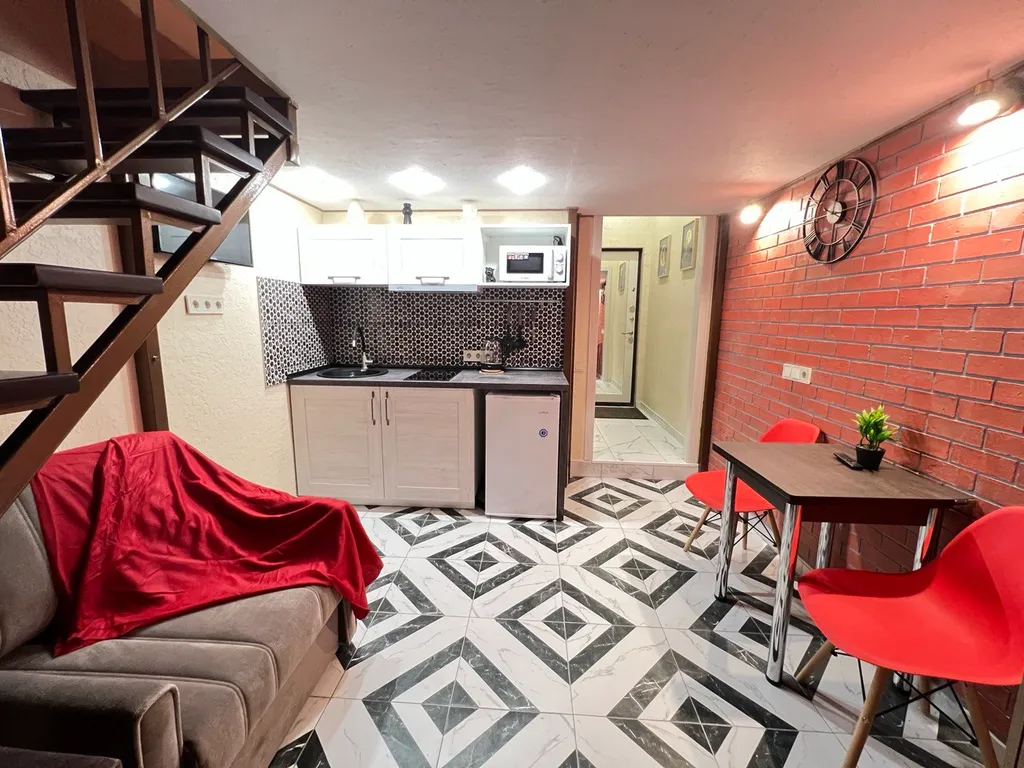 Стильная двухуровневая студия Лофт