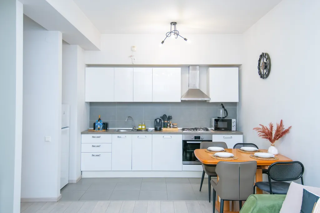 Уютные апартаменты с видом на колесо обозрения и город