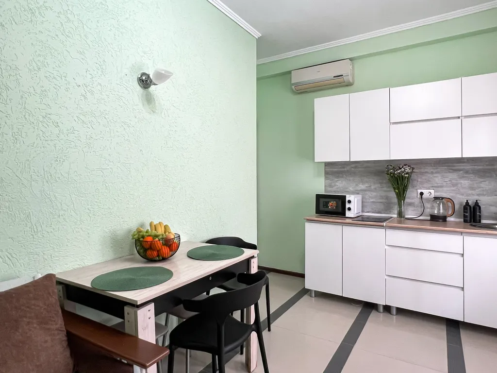 Семейный номер с кухней в центре