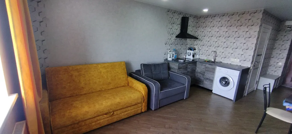 Уютная студия с видом на городской стадион Авангард