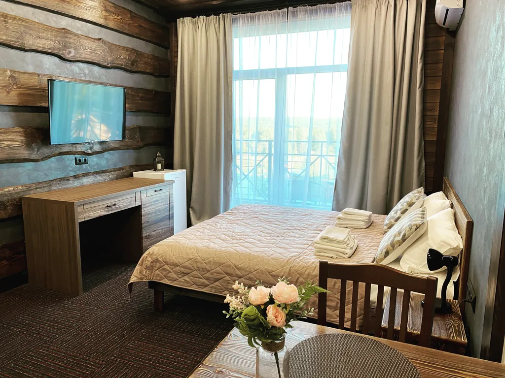 Уютные семейные апартаменты c видом на водоём и горы