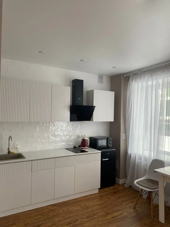 Уютная студия в зеленом массиве