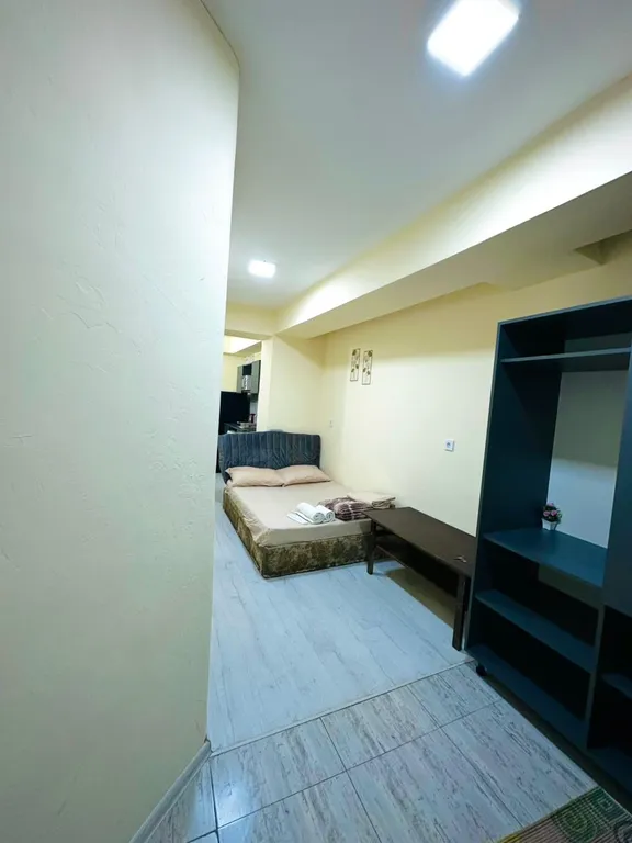 В центре рядом с музеем Сергея Параджанова