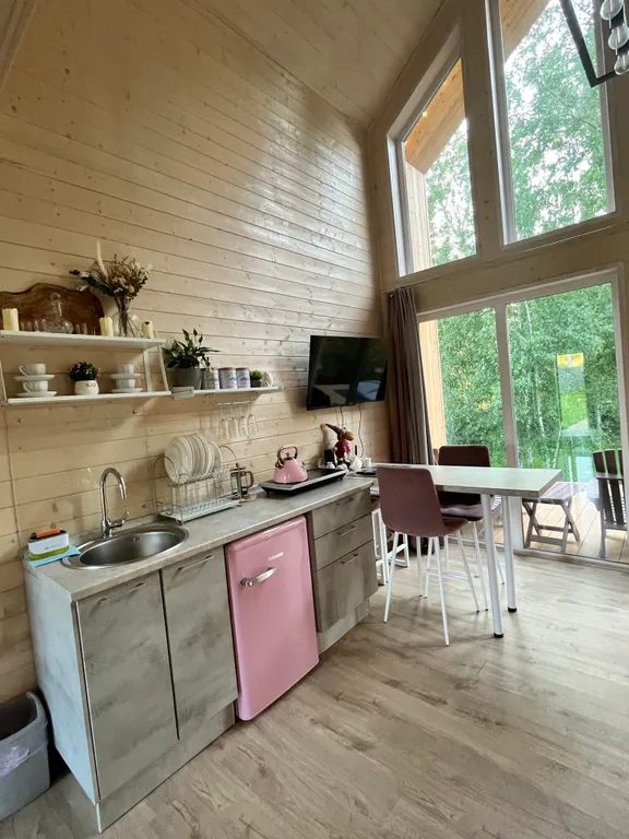 Дом с купелью на берегу реки