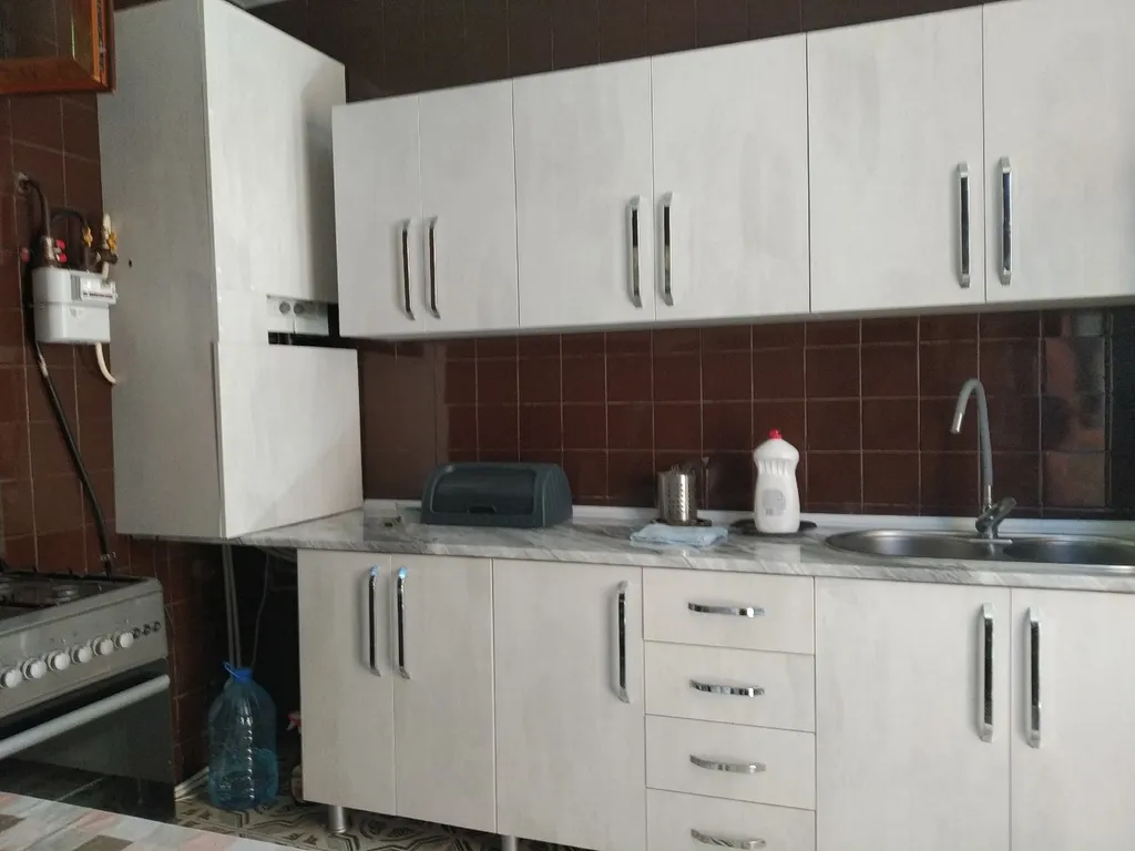 Флигель с балконом в саду