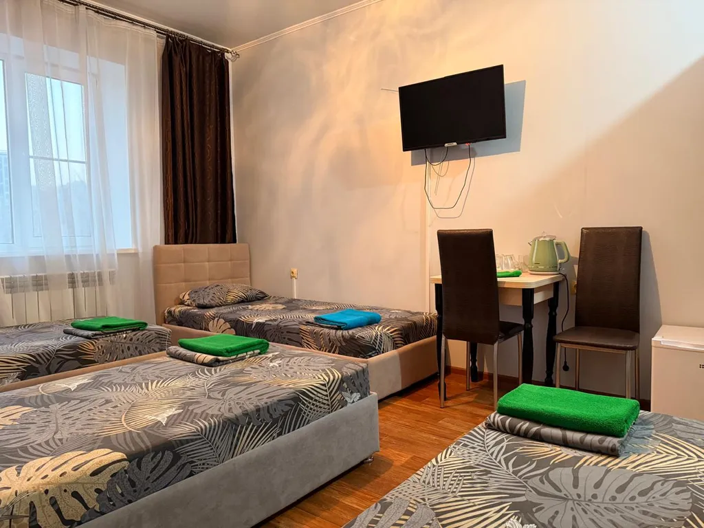 Четырехместный номер с 4-мя односпальными кроватями