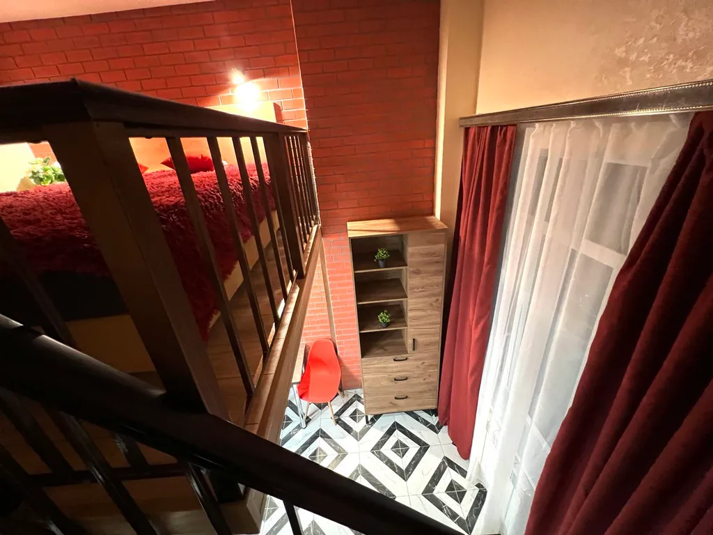 Стильная двухуровневая студия Лофт