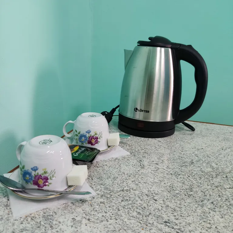 Семейный номер с двухспальной кроватью и диваном