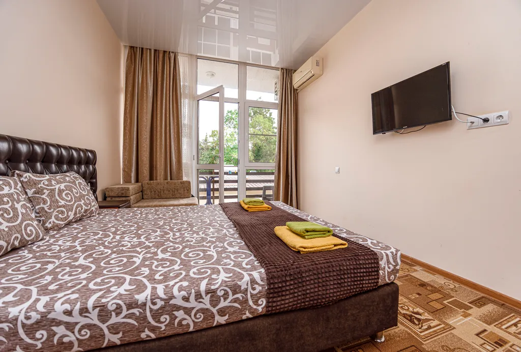 Двухместный номер с двуспальной кроватью и балконом