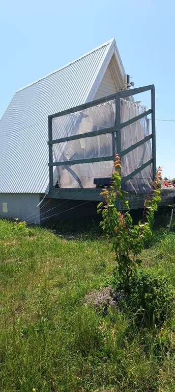 Тpеугольный дом A-frаmе с видом на море