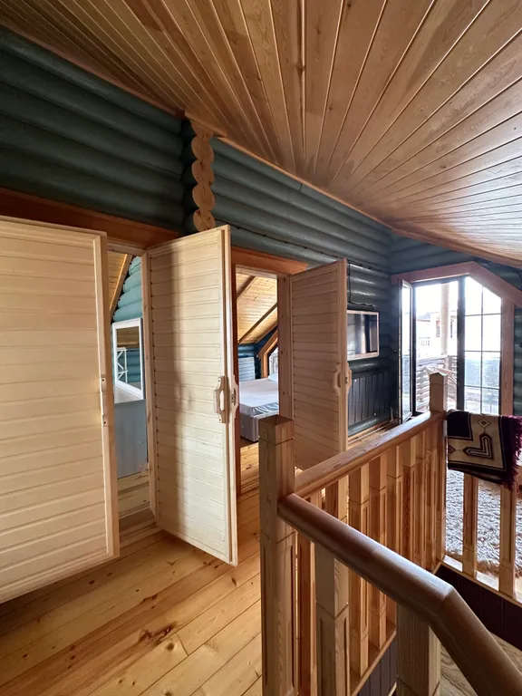 Дом из бруса на берегу моря с зоной барбекю и собственной парной