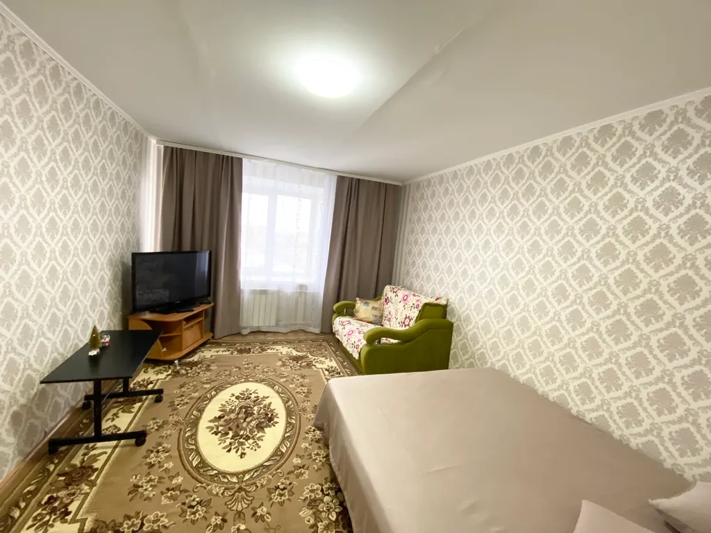 Квартира Уютная двухкомнатная квартира в Нефтяниках — Омск