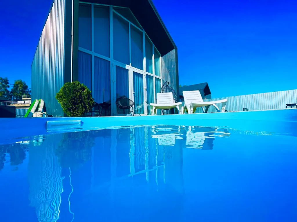 Дом в стиле БарнХаус с тёплым бассейном