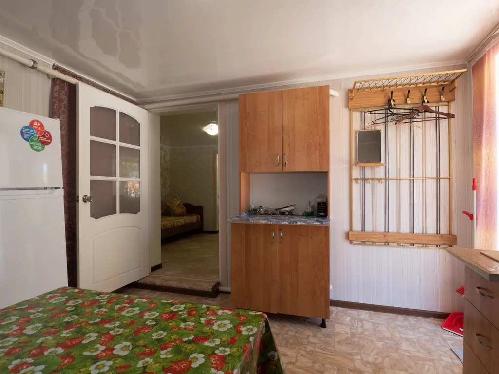 Уютный домик в беседках винограда