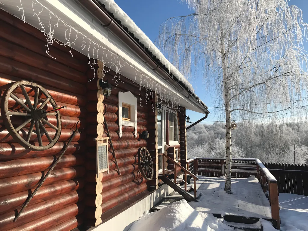Дом из бревна Терем с сауной в черте города