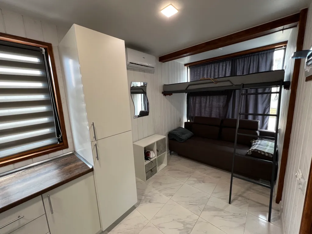 Домик в лесу у моря с верандой