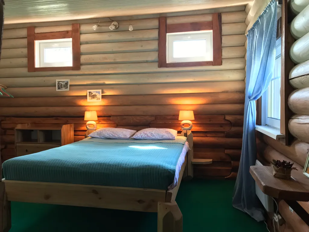 Дом из бревна Терем с сауной в черте города