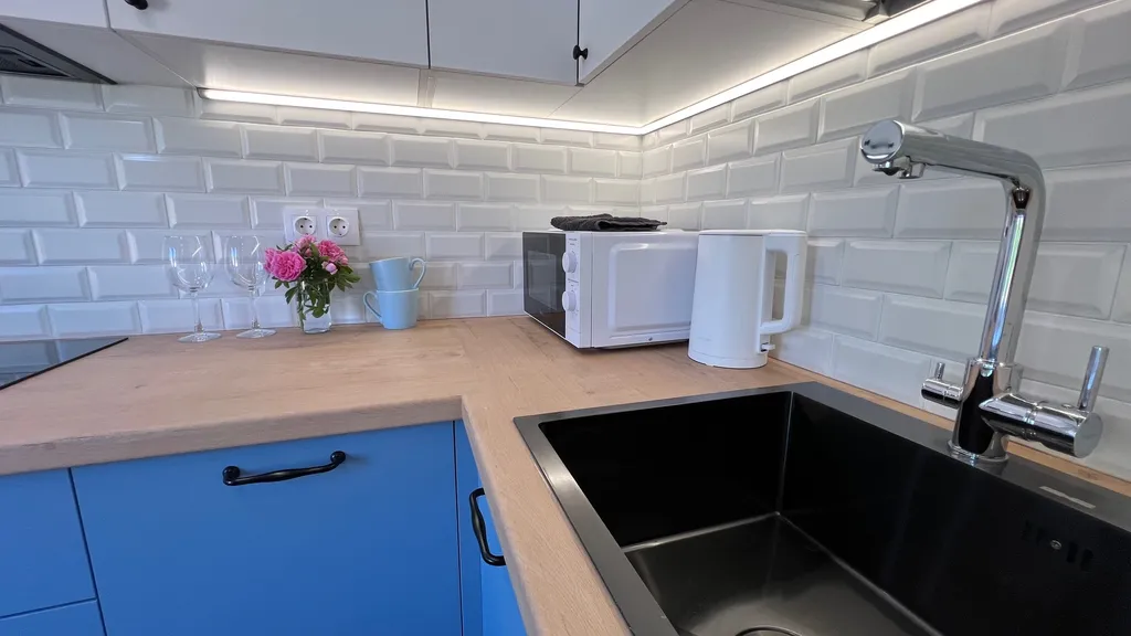 Апартамент у часовой башни и дома гильдии