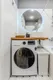 Новая стиральная машинка и корзина для белья