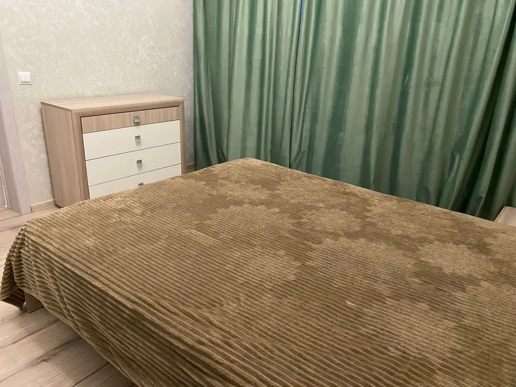 Уютная квартира в новом доме в 10 минутах от центра города