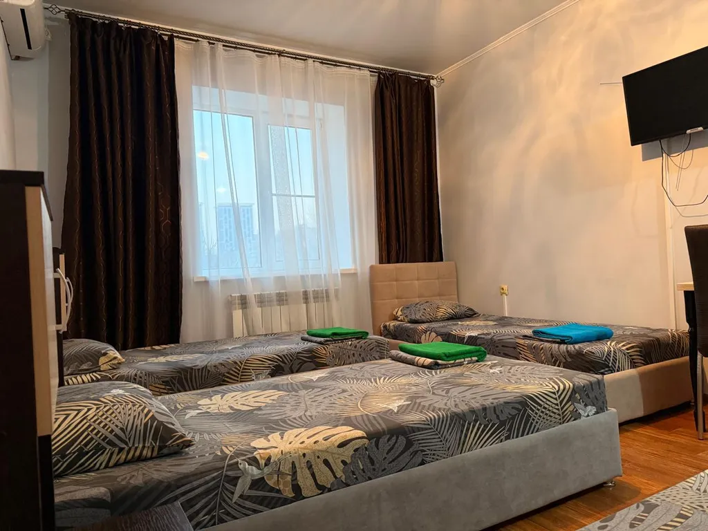 Четырехместный номер с 4-мя односпальными кроватями