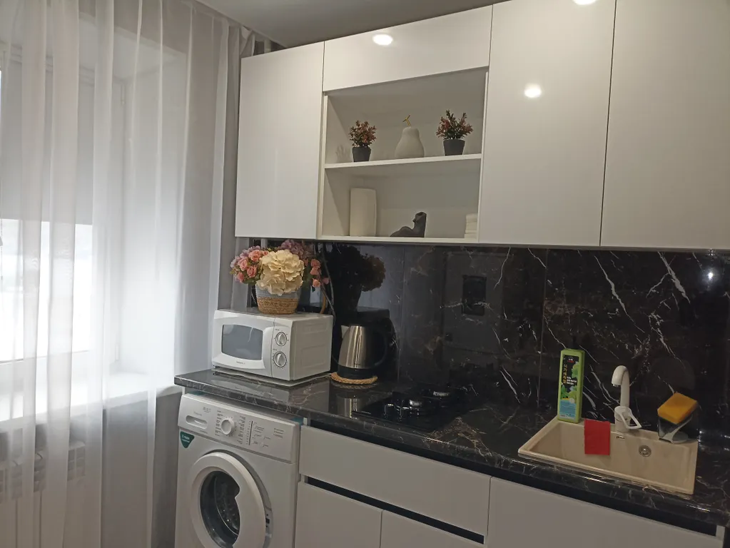 1-комнатная квартира в центре города с асфальтированной парковкой