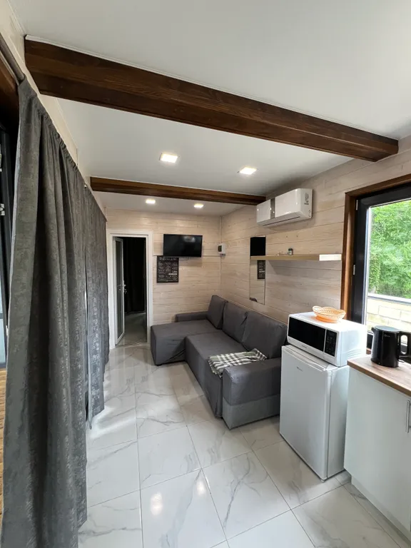 Домик в лесу с большой верандой