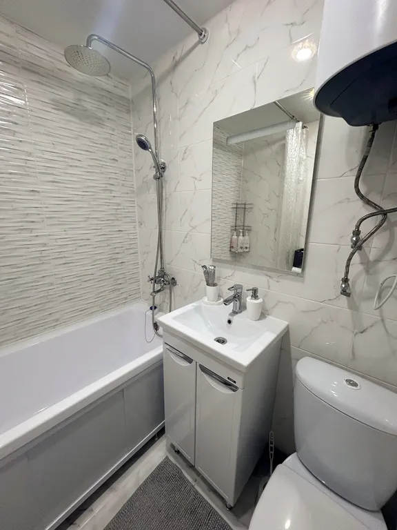 Комфортная квартира с совмещенной кухней-гостиной и уютной спальней