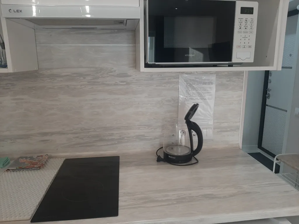 Уютная студия с видом на колесо обозрения