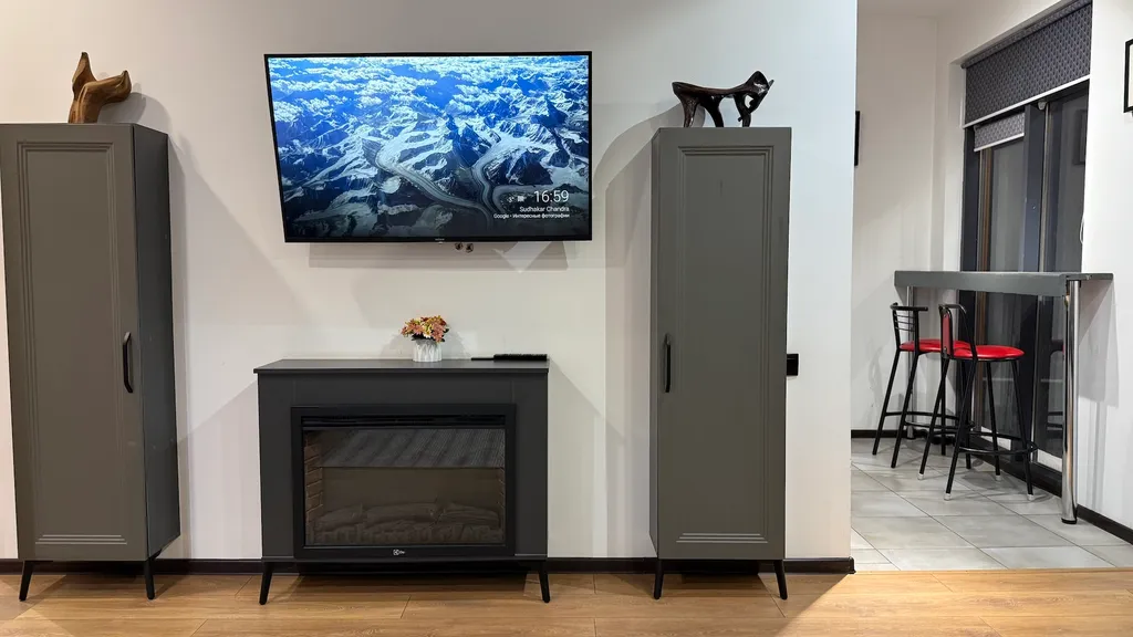 Апартаменты с террасой с видом на город и горы