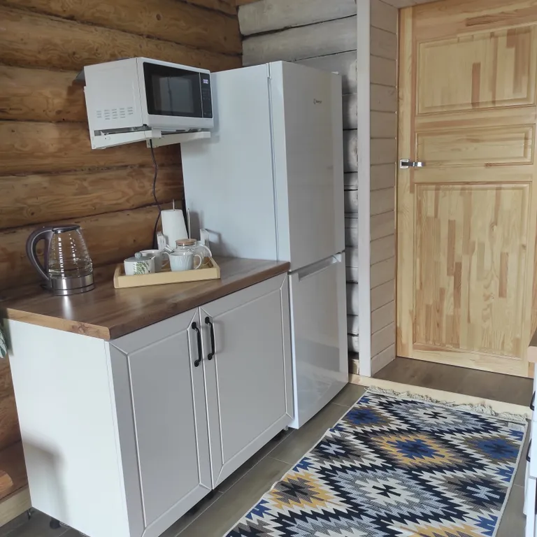 Экодомик из рубленого бревна с дровяной сауной