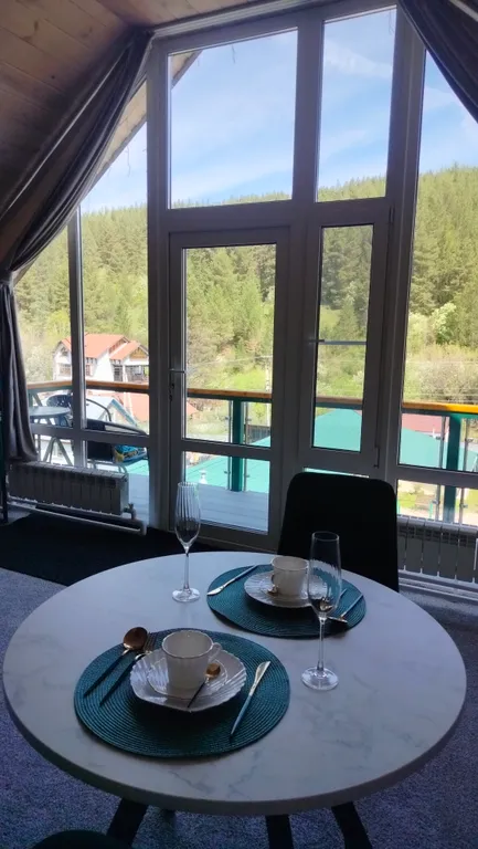 Апартаменты Романтика с панорамным окном в мансарде дома