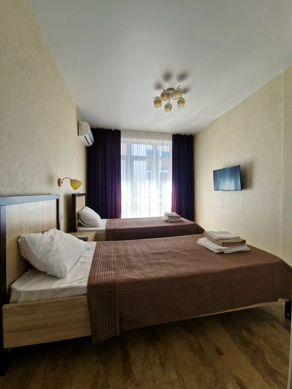 Комфортабельный двухкомнатный  номер с кухонной зоной