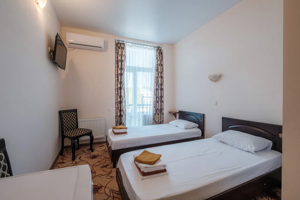 Двухместный номер категории Стандарт с раздельными кроватями