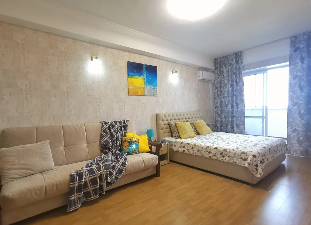 Солнечная квартира с видом на город