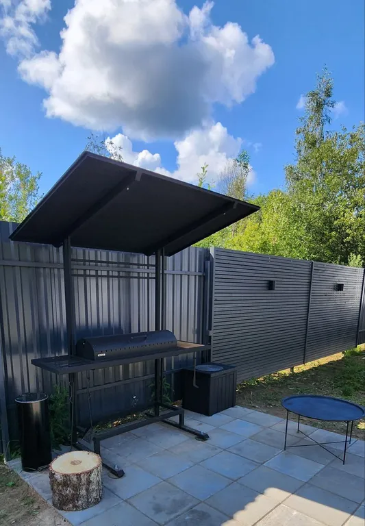 Уютный треугольный дом в 25 км от Минска с видом на лес.