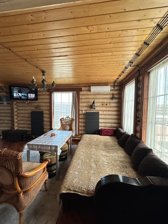 Дом из бруса на берегу моря с зоной барбекю и собственной парной