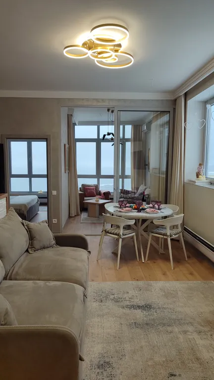 Апартамент Любимое Небо - море и горы - наслаждаться лежа на кровати