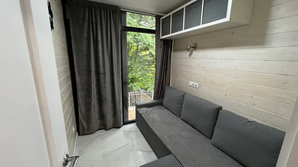 Домик в лесу с большой верандой