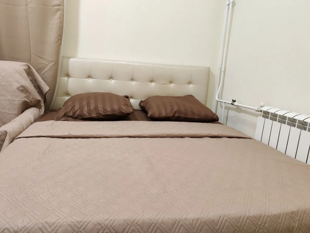 Светлая квартира с большими окнами и высокими потолками