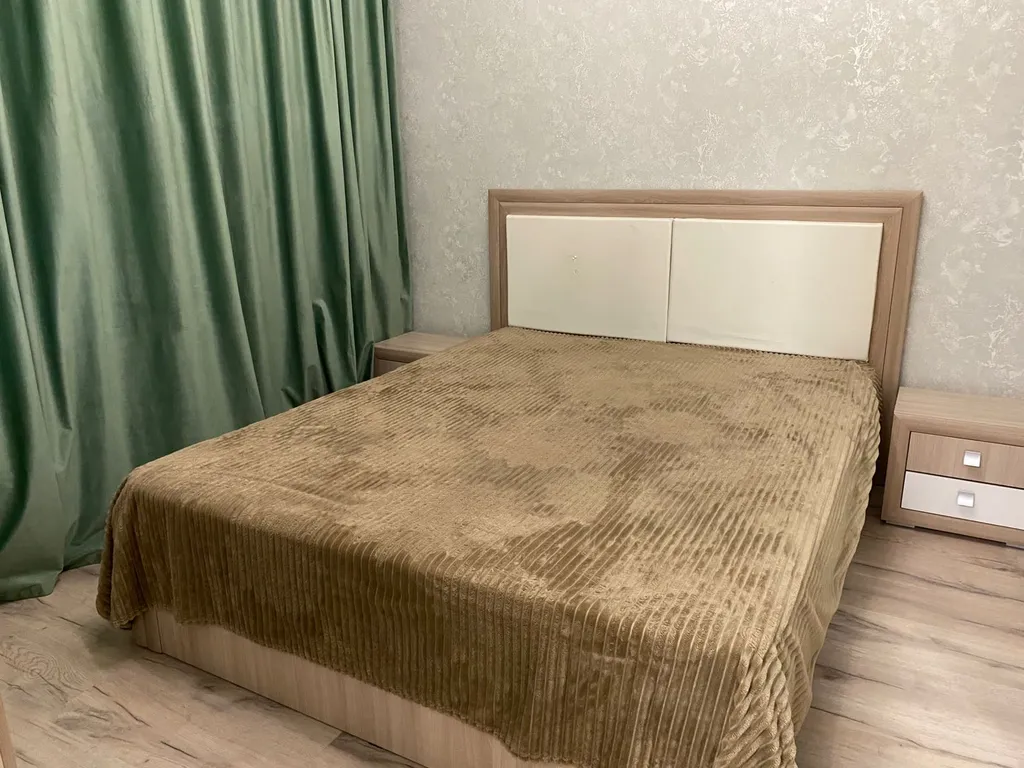 Уютная квартира в новом доме в 10 минутах от центра города