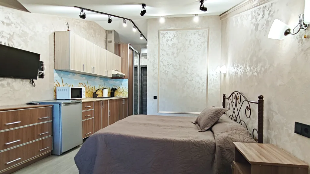 Уютная студия с балконом и красивым видом на горы