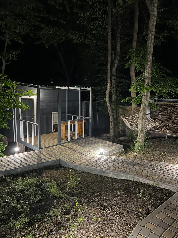 Домик в лесу с большой верандой